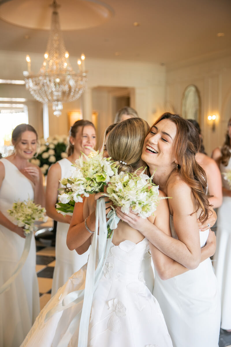 caitlin hugging bridesmaid