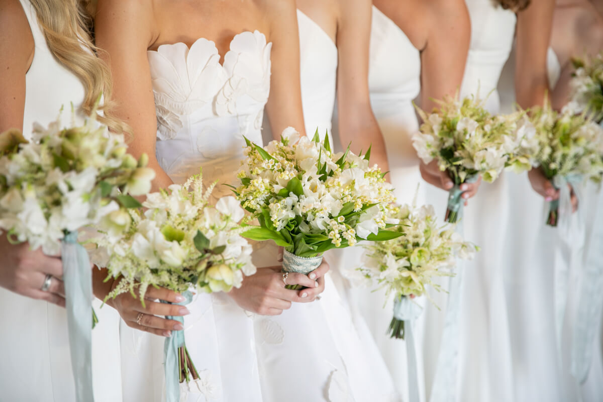 hands holding bouquets
