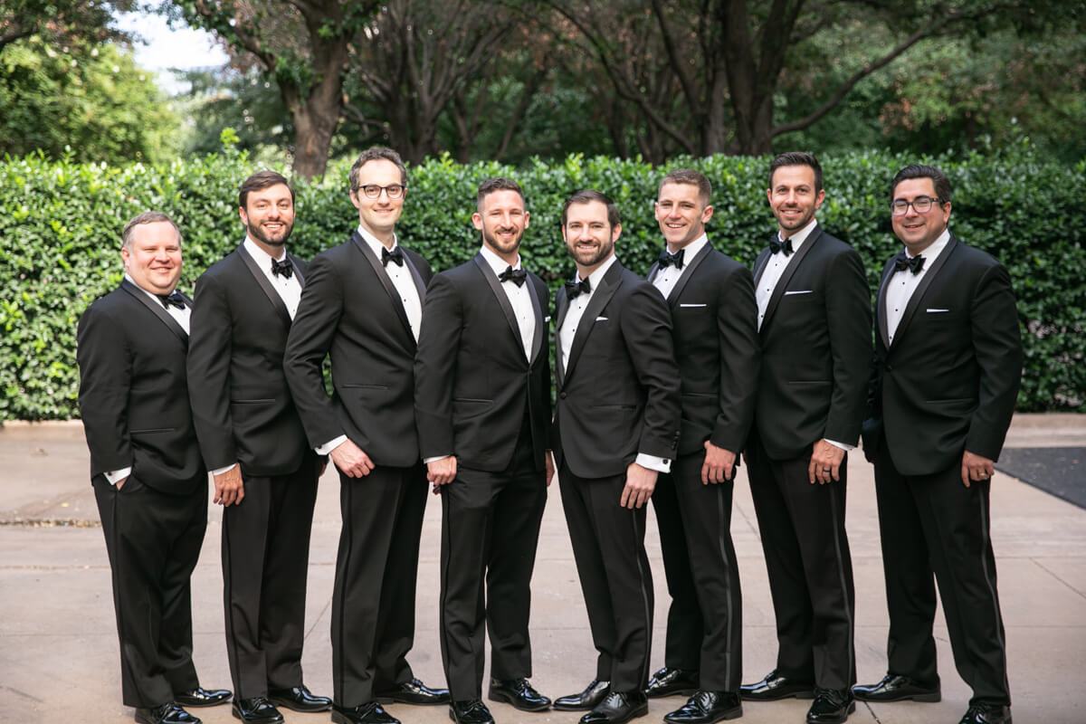david posing outdoors with groomsmen