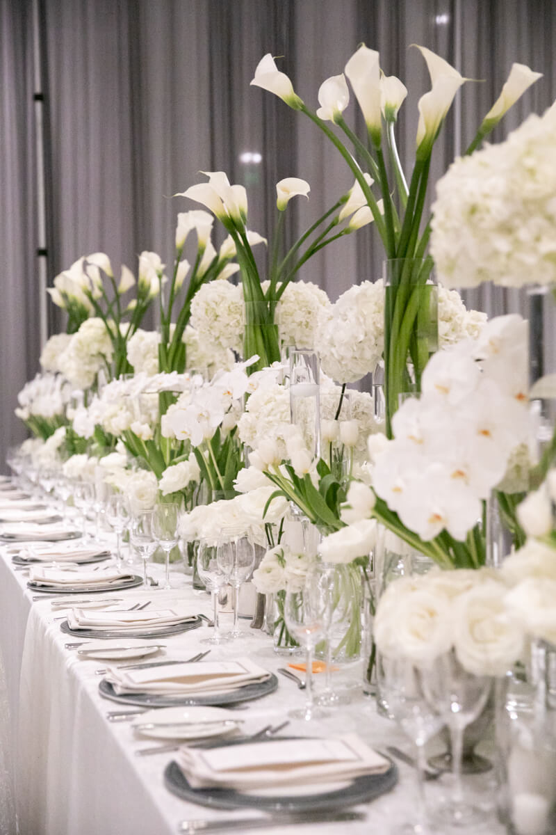 tiered white floral arrangements