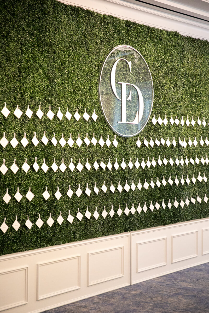 boxwood wall of escort cards