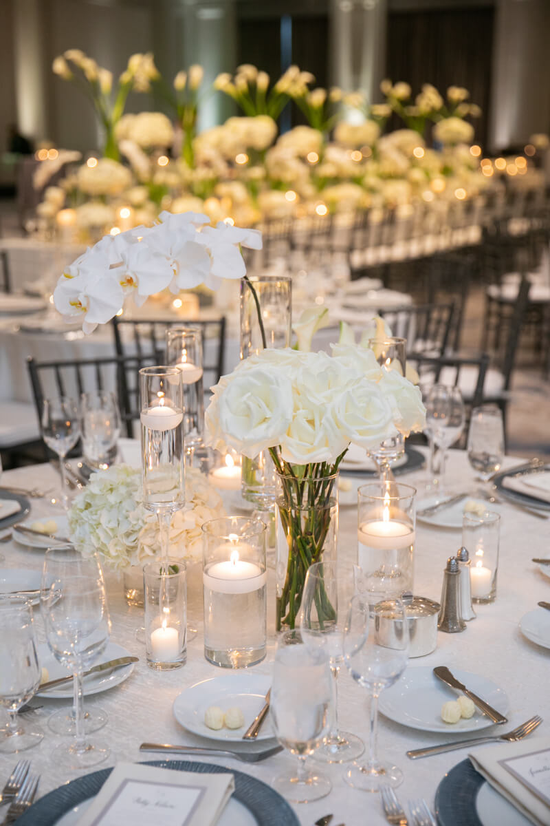 orchid and roses on a dining table
