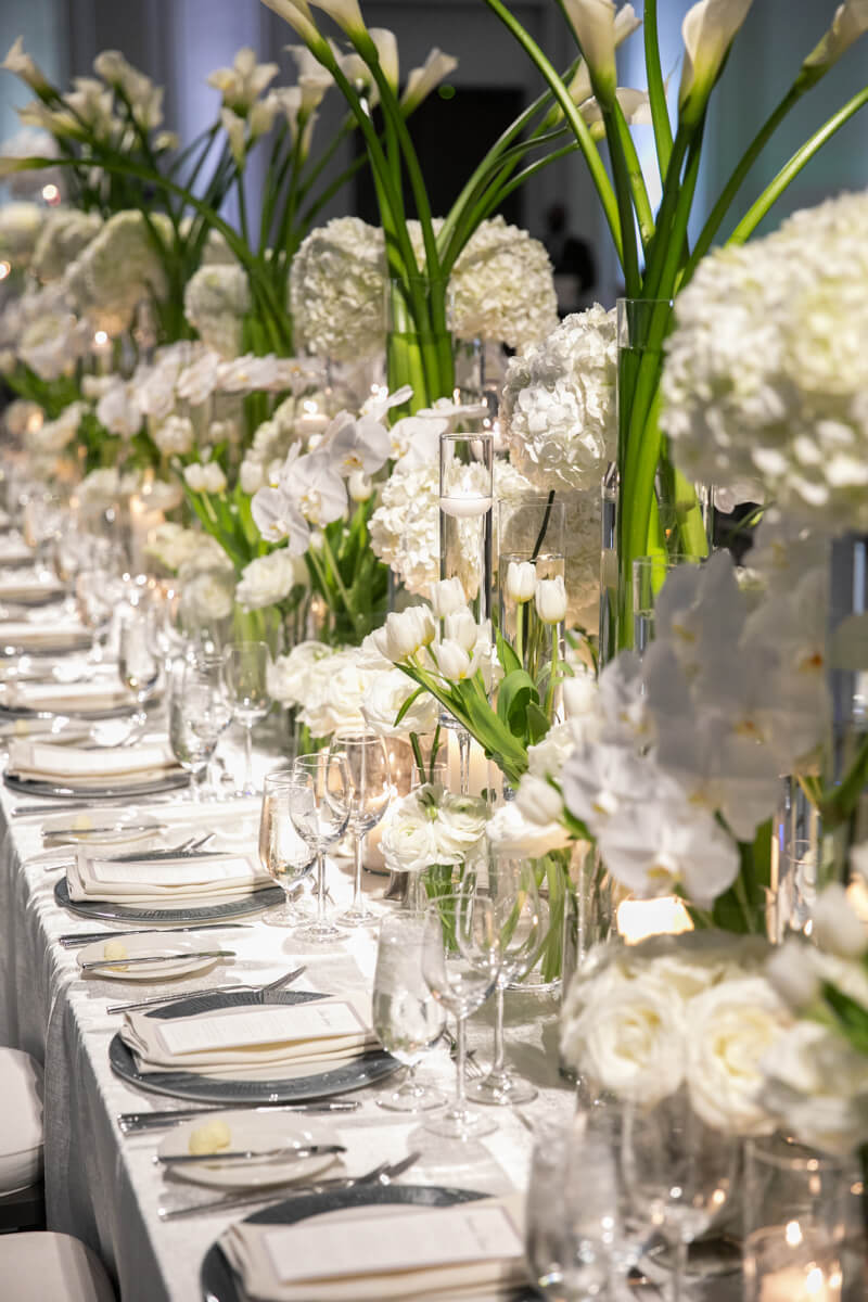 tiered white floral arrangements