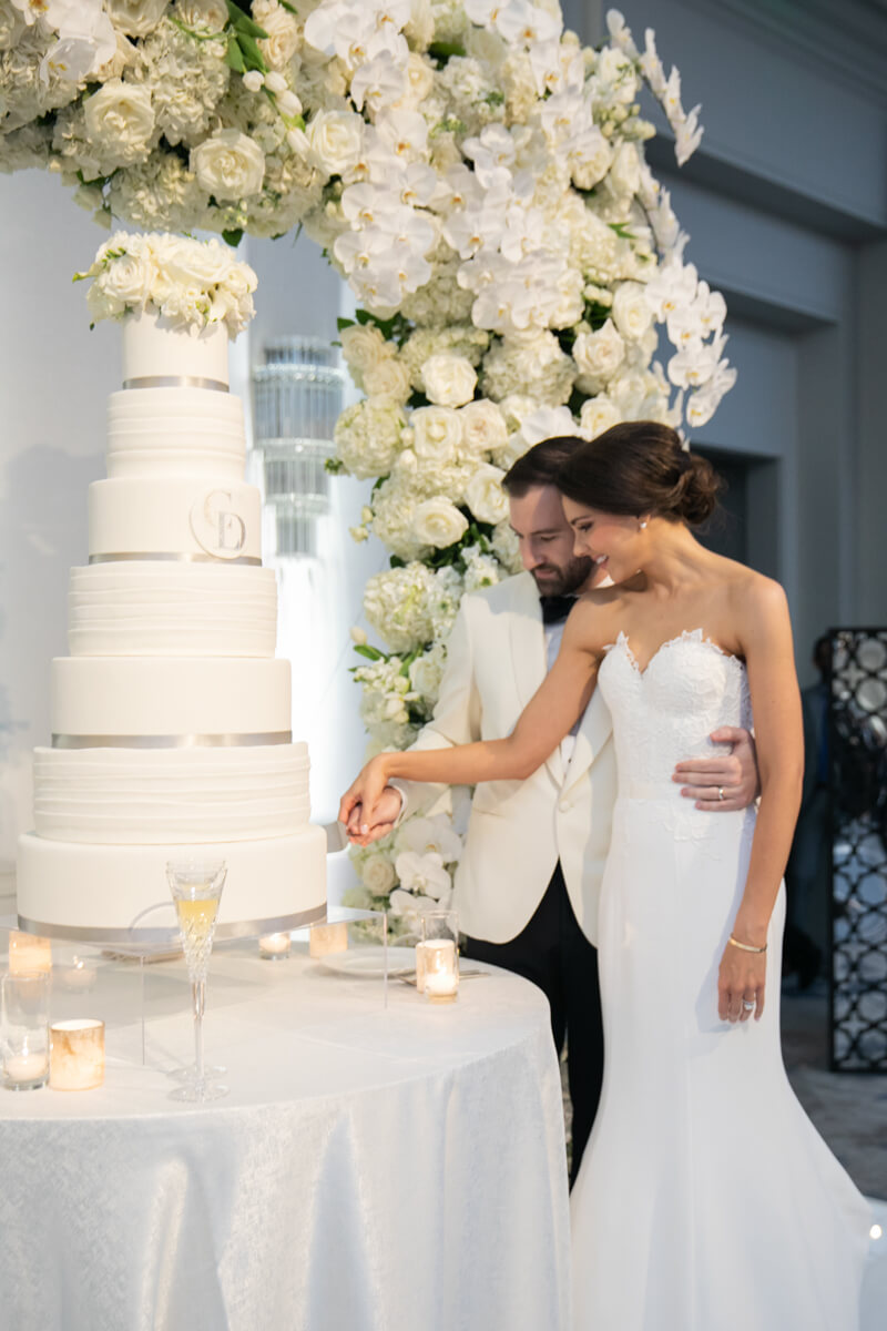 carey and david cutting their wedding cake