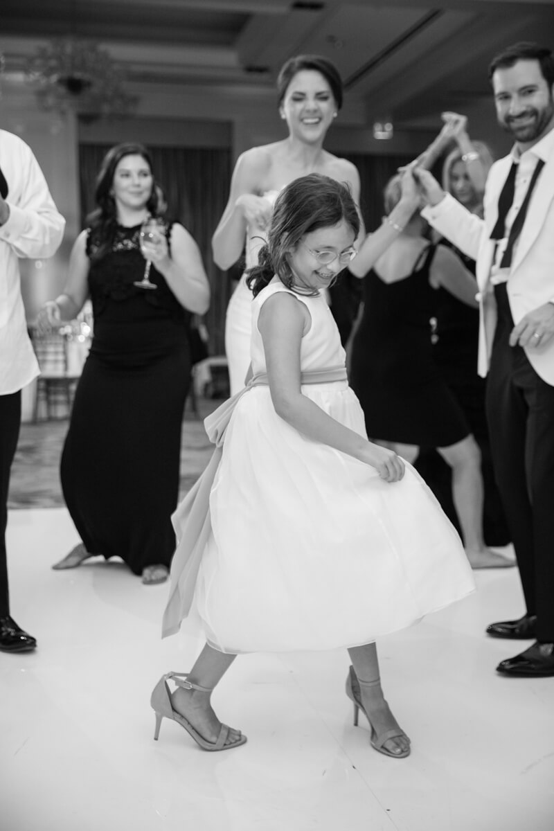 little girl dancing with some else's high heels on