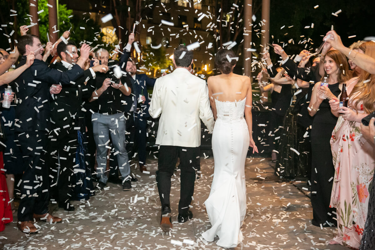 carey and david walking away through confetti