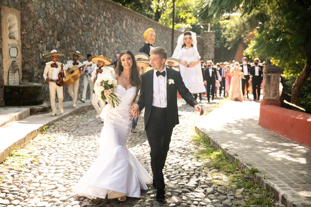 alicia and hunt leading their wedding parade