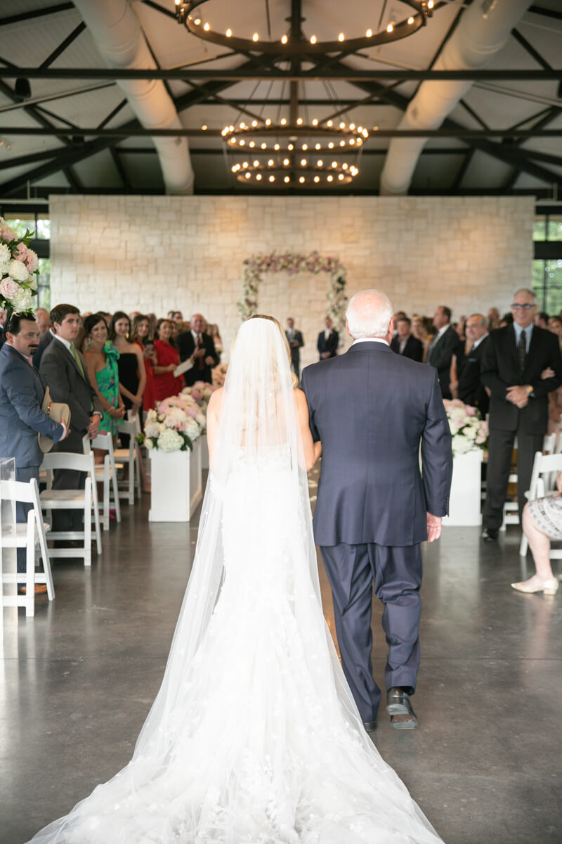 brittney and her dad walking down the aisle