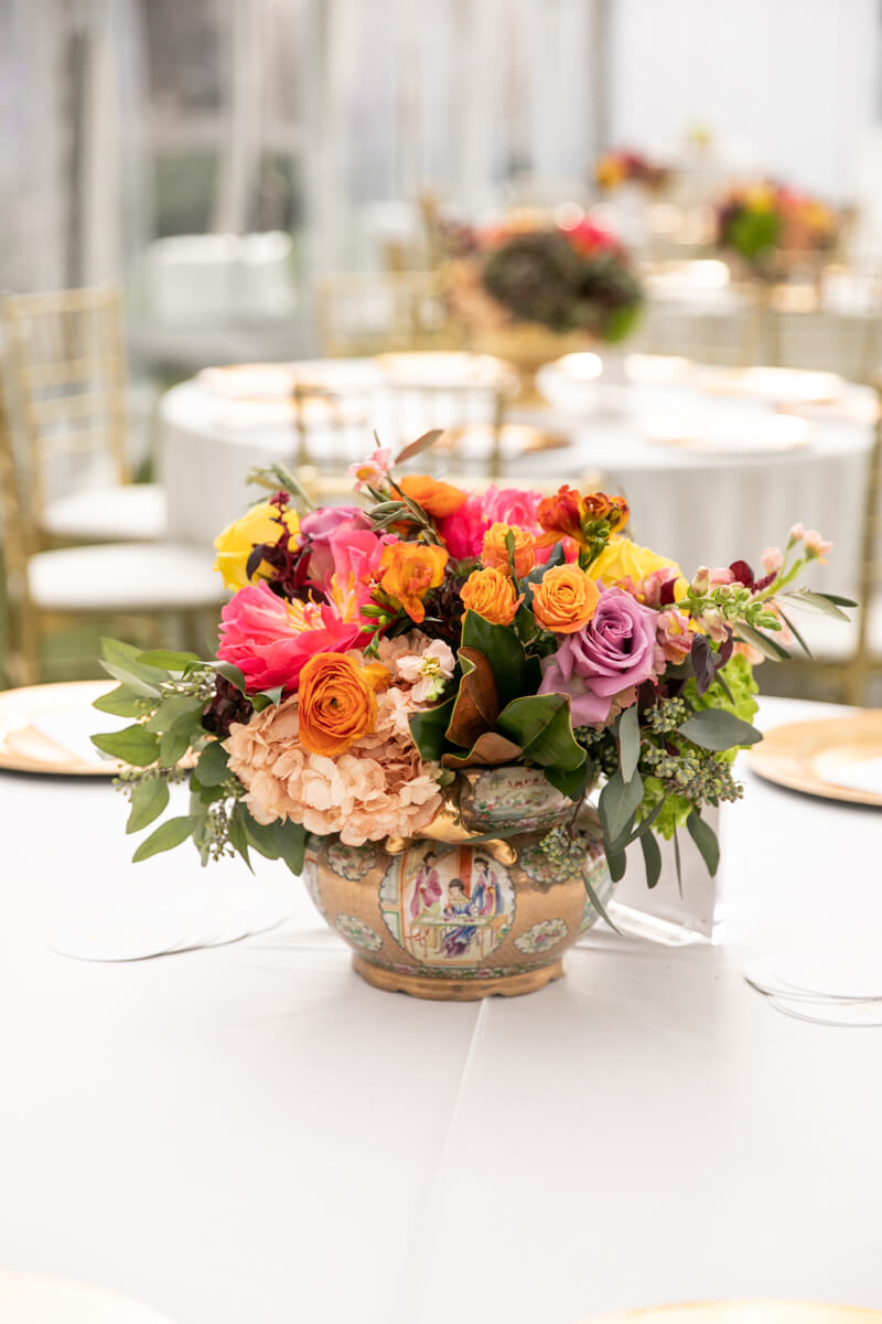 floral arrangement in gold pot
