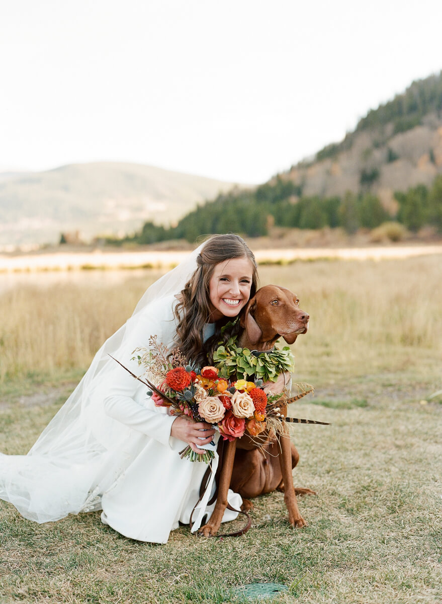 bride hugging her dog