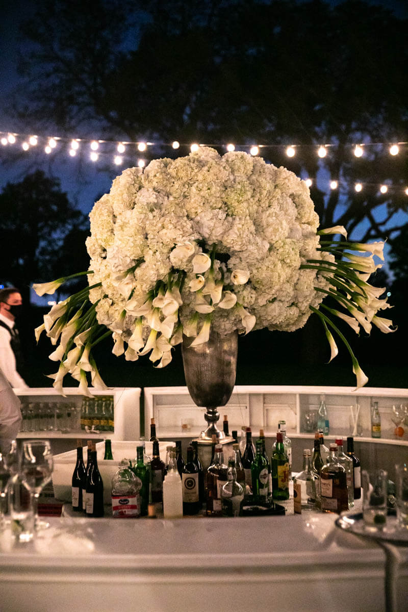 all white floral arrangement outside