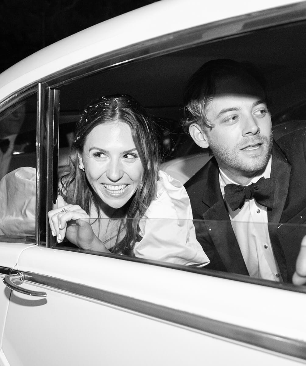 Photo of Bride and Groom in car