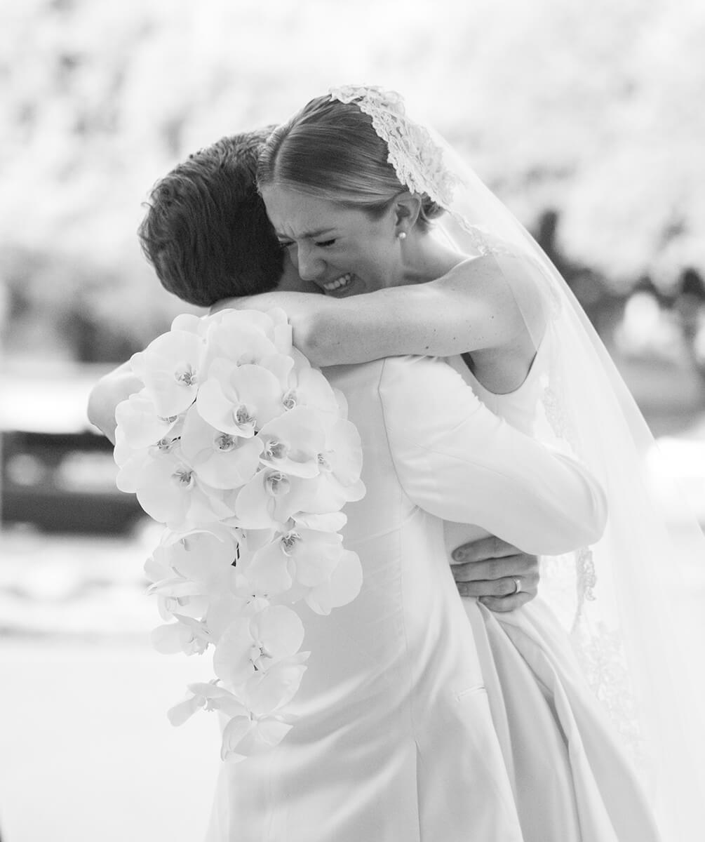 Bride and groom embracing after ceremony